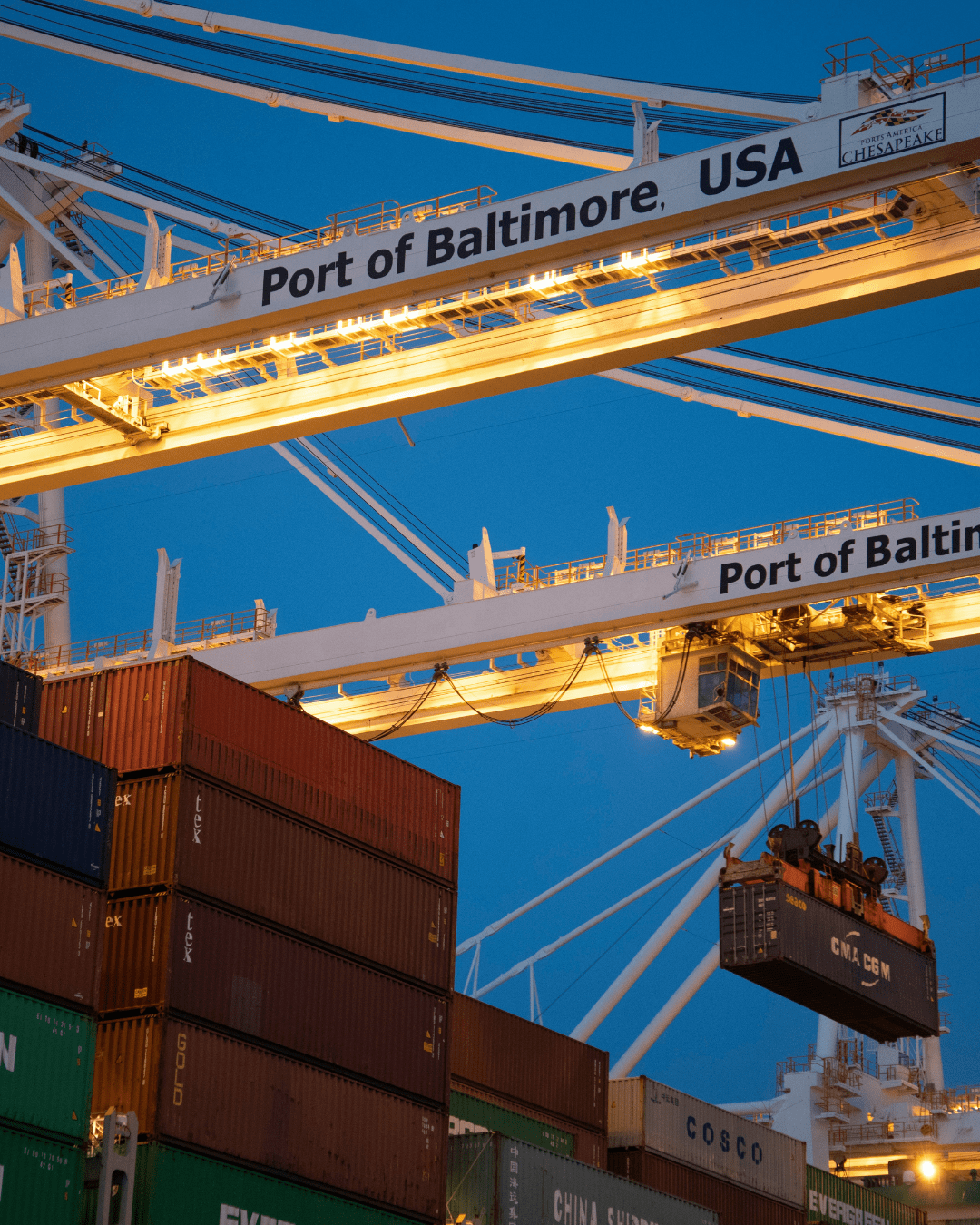 Cranes loading shipping containers at the Port of Baltimore for international export operations